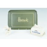 A composition Harrods tray, together with a Lurpak butter dish and matching egg cup, tray 33 x 22