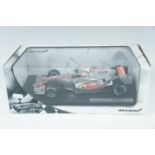 A Hot Wheels diecast McLaren F1 racing car MP4-22, Lewis Hamilton