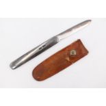A George V folding silver fruit knife by Sampson Morden, having silver grip scales and retaining its