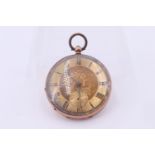 A late 19th Century yellow metal pocket watch, having a key wind and set movement in a floral