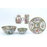 A group of Chinese famille vert ceramics, comprising a teapot, a brush pot, two matching bowls and a