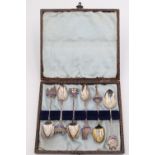 Six enamelled silver souvenir teaspoons relating to London, in an associated case, A J Bailey,