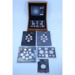 Two The Royal Mint 2008 proof coin collections, one in a wooden presentation box and the other in