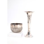 A Victorian silver sugar basin having ribbed sides, London, 1888, and a George V trumpet form silver