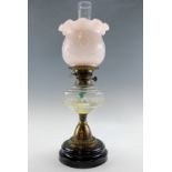 A late 19th / early 20th Century glass and brass oil lamp, 57 cm