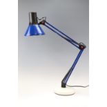 An Anglepoise style desk lamp in blue and white