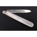 A Victorian silver and mother of pearl folding fruit knife, the grips having engraved decoration and