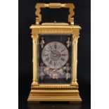 A late 19th Century repeating gilt metal carriage clock, having a key wind and set two train