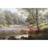 William Mellor (1851 - 1931) An enchanting riverscape bathed in sunlight and lush foliage, with cows