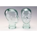 Two glass mannequin display heads