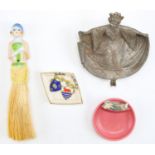 A 1940s Japanese kitsch cast aluminium trinket dish of a geisha, a 1920s porcelain figural handled