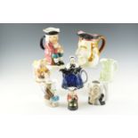 Seven character jugs, (tallest 23 cm), together with a Tony Wood teapot