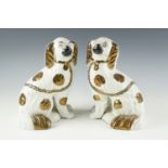 A pair of Victorian Staffordshire spaniels, 23 cm, (one a/f)