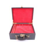 A vintage leather covered jewellery case, having a lift out tray with a ring holder, the cover