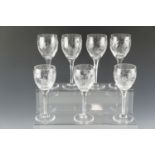 Seven large Stuart crystal wine glasses decorated with fushias, 21.5 cm together with a boxed set of