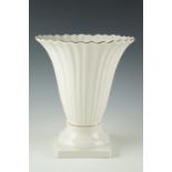 A large Belleek vase, 21.5 x 25.5 cm