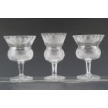Three Edinburgh Crystal thistle glasses, tallest 13 cm