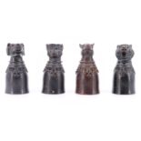 Four Chinese patinated cast bronze animal headed candle snuffers / drinking vessels, variously being