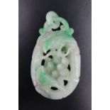 A Chinese carved jade pendant in the form of birds on a bough, 6.5 cm