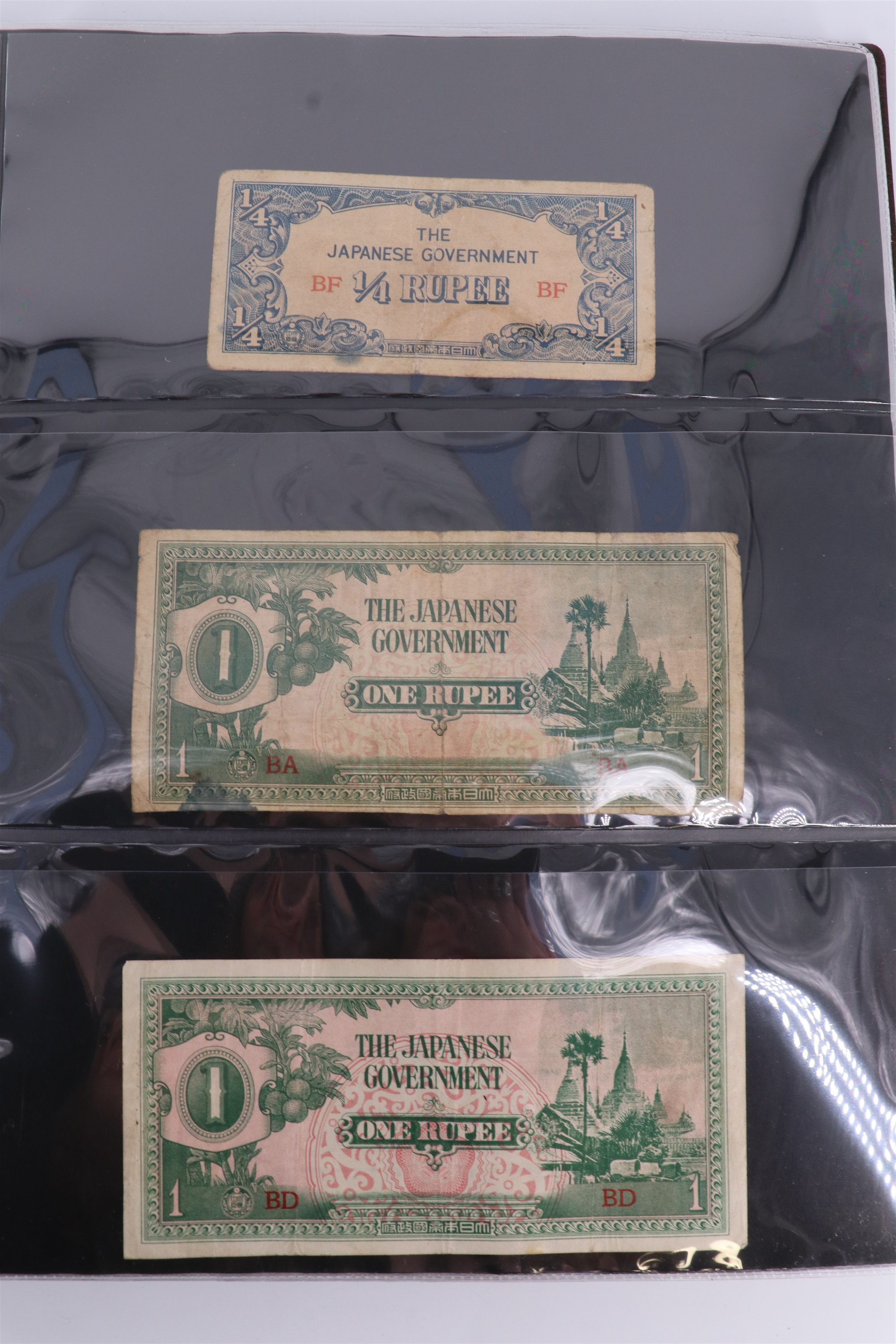 An album containing a collection of world banknotes, including Zaire (DR Congo), Ireland, - Image 34 of 87