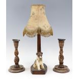 A 1930s West Highland terrier figural table lamp, patinated walnut, together with a pair of oak