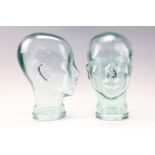 Two glass mannequin display heads