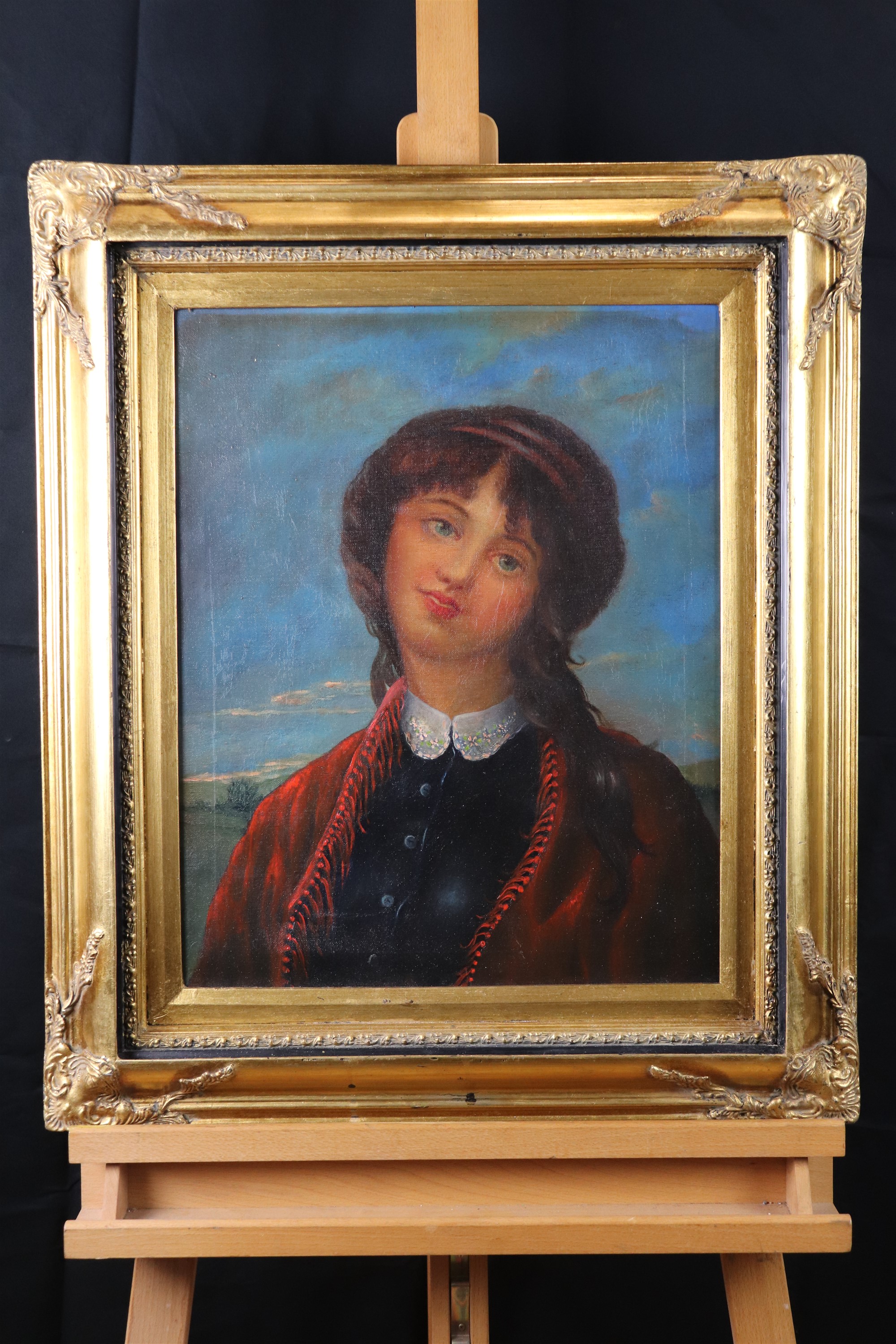 A naive, romantic portrait of a young woman wearing a red tasseled shawl, oil on canvas, late - Image 2 of 2