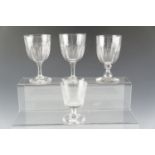 Three 19th Century glass rummers together with another 19th Century cut wine glass bearing an etched