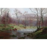 William Mellor (1851 - 1931) An autumnal, peaceful riverscape with cows wading into the water,