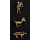 Three late 19th / early 20th Century Akan Ashanti cast brass gold dust weights, comprising a figural