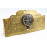 A German Third Reich Luftwaffe aircraft cockpit clock, mounted onto a brass stand by a Royal Army