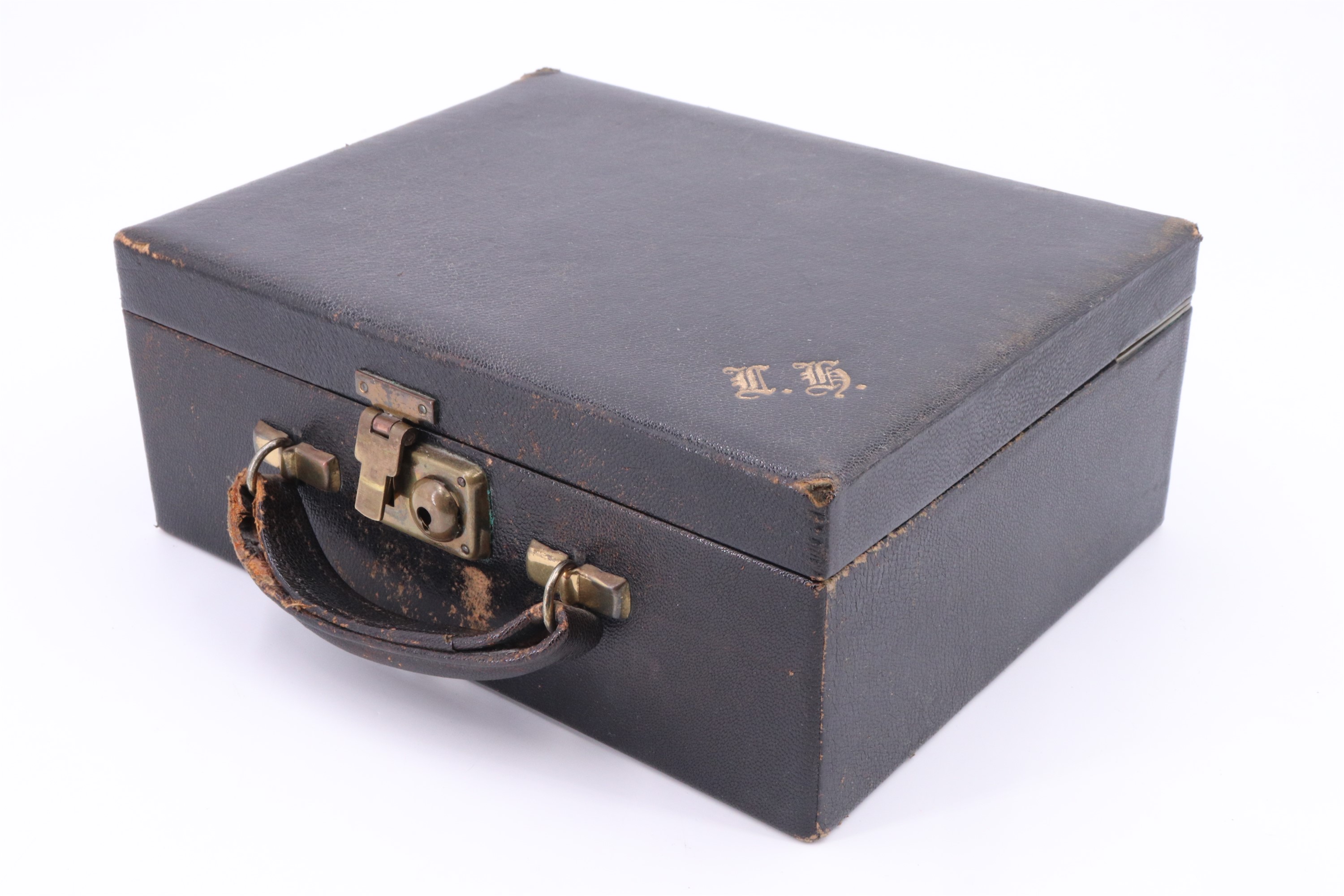 A vintage leather covered jewellery case, having a lift out tray with a ring holder, the cover - Image 3 of 3