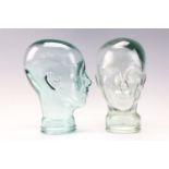 Two glass mannequin display heads