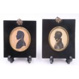 Two early 19th Century silhouettes of gentlemen, in gilt metal mounted lacquered frame, 13 cm x 11