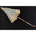 A Victorian lace parasol, with ivory terminal and folding handle, 65 cm excluding loop (Animal and