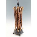 A large Victorian mahogany and brass wool winder, having a brass and turned ebonised stand and