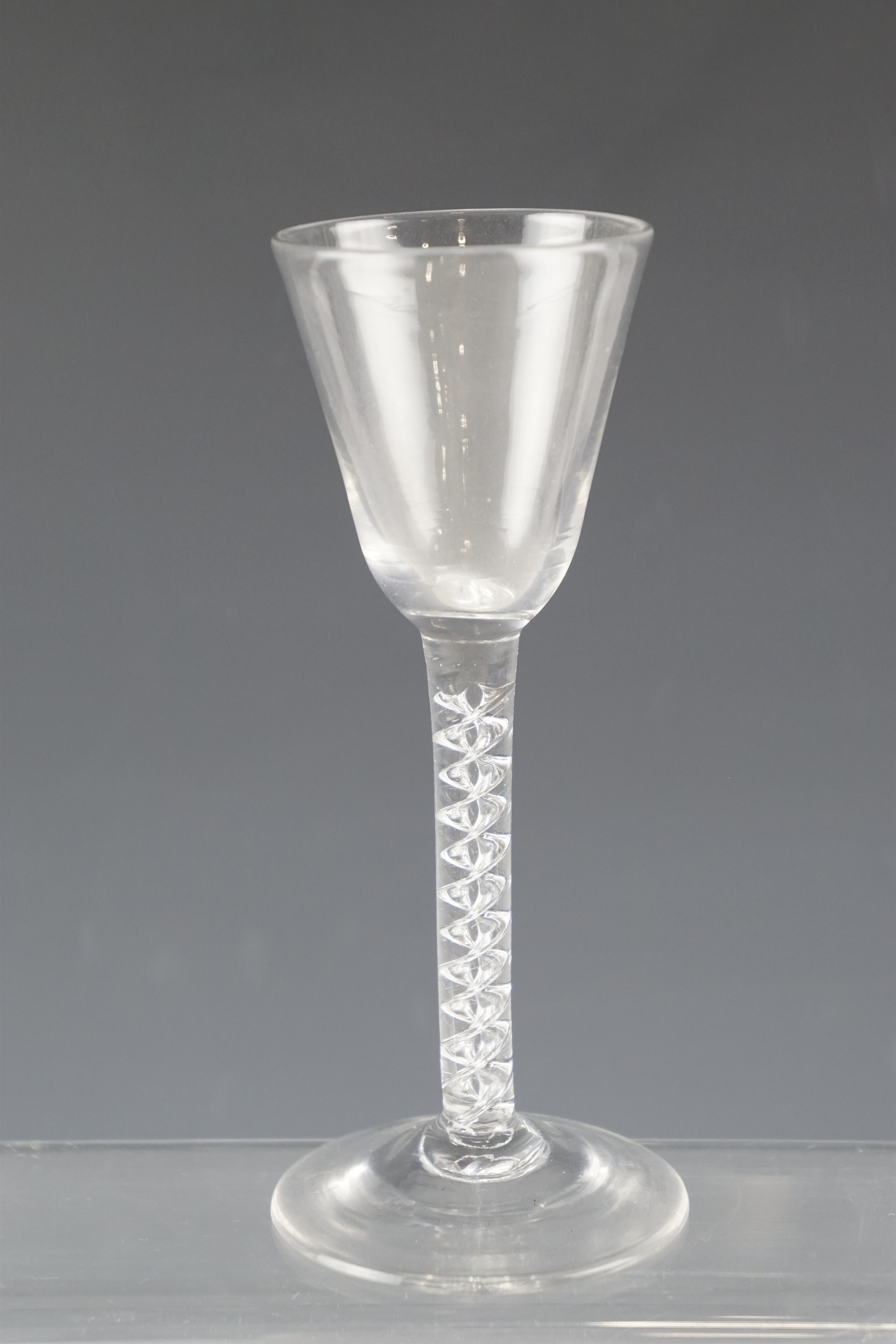 A mid 18th Century wine glass having a double spiral air twist stem, 15.5 cm