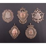Five early 20th Century silver watch chain fob medallions