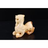A small Chinese carved jade guardian lion, 2 cm