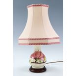 A Moorcroft "Magnolia" pattern table lamp, 24 cm excluding shade