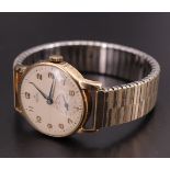 A 1950s Smiths 9 ct gold wrist watch, having a 15 jewel movement and mat dial with Arabic