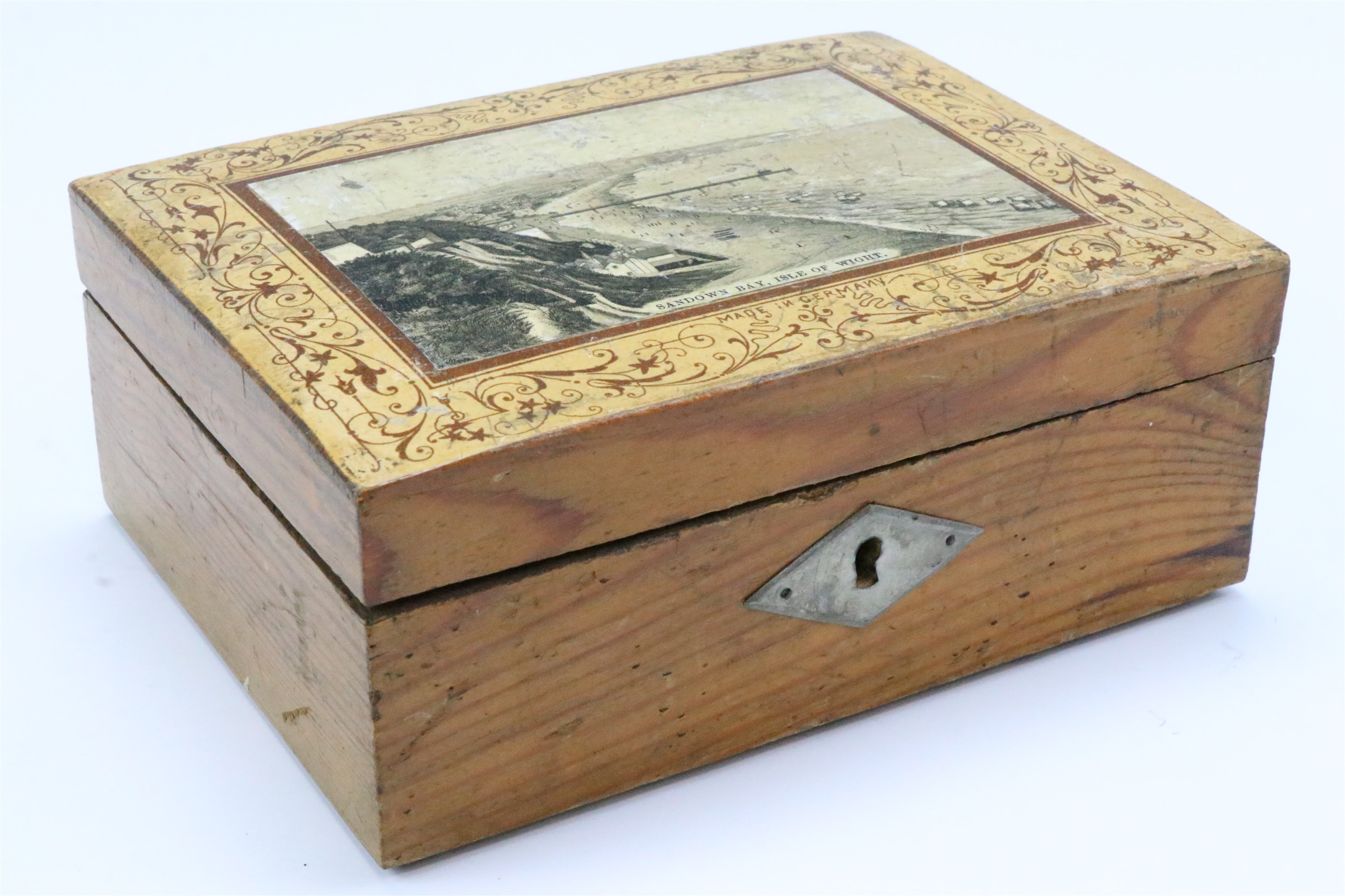 An early 20th Century German pine souvenir table box, the hinged lid lacquered in depiction of