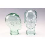 Two glass mannequin display heads