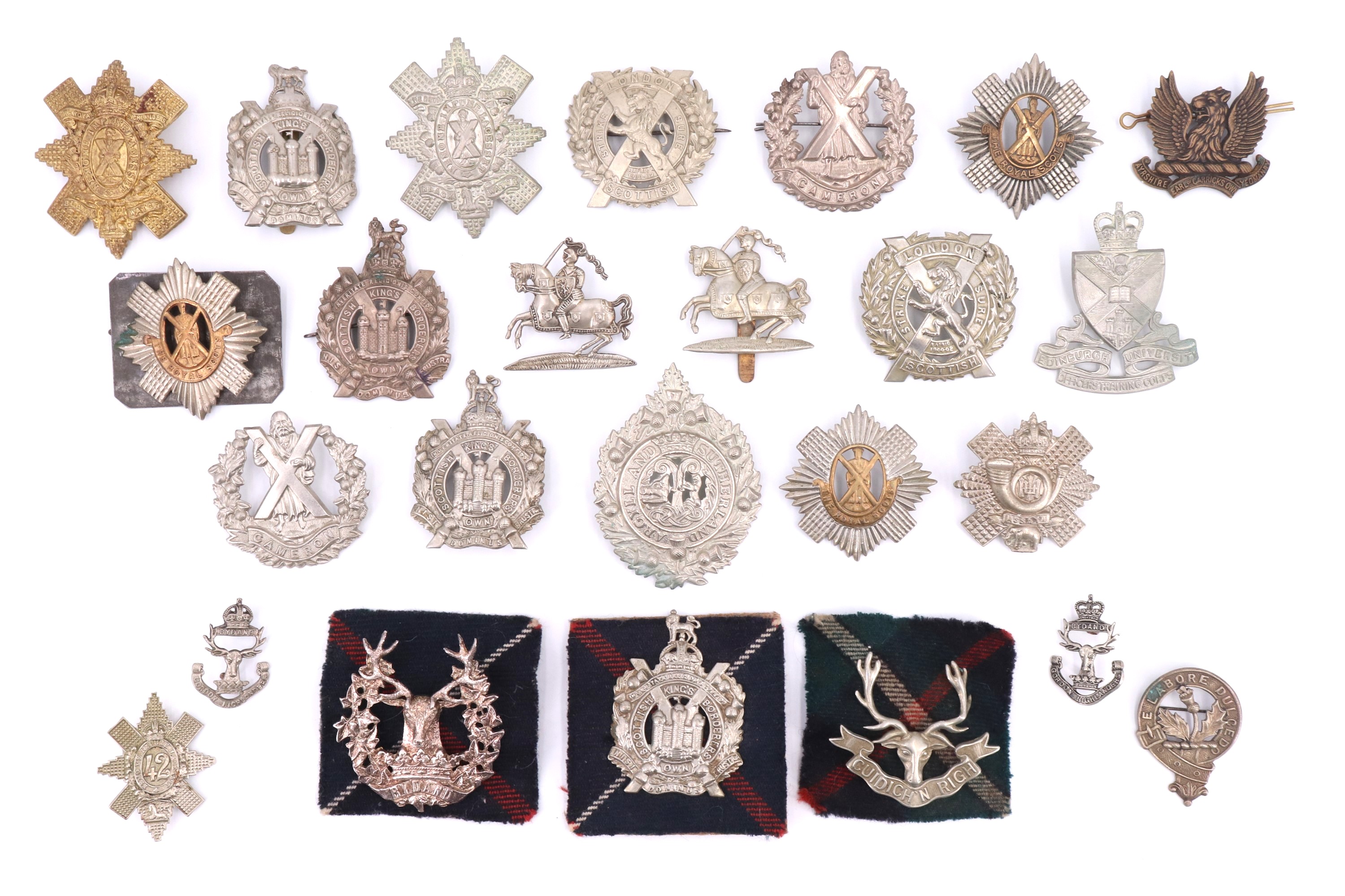 A collection of Scottish cap and other badges