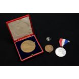 Three coronation medals comprising Edward VII, cased, George V and George VI, together with a