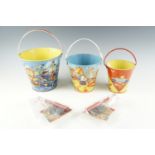 Three Chad Valley children's tinplate sand buckets together with two spades and brushes, tallest