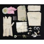 Vintage wedding items including wax and fabric corsages, cake decorations, handkerchiefs and silk