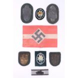 A group of reproduction German Third Reich arm shields and other insignia
