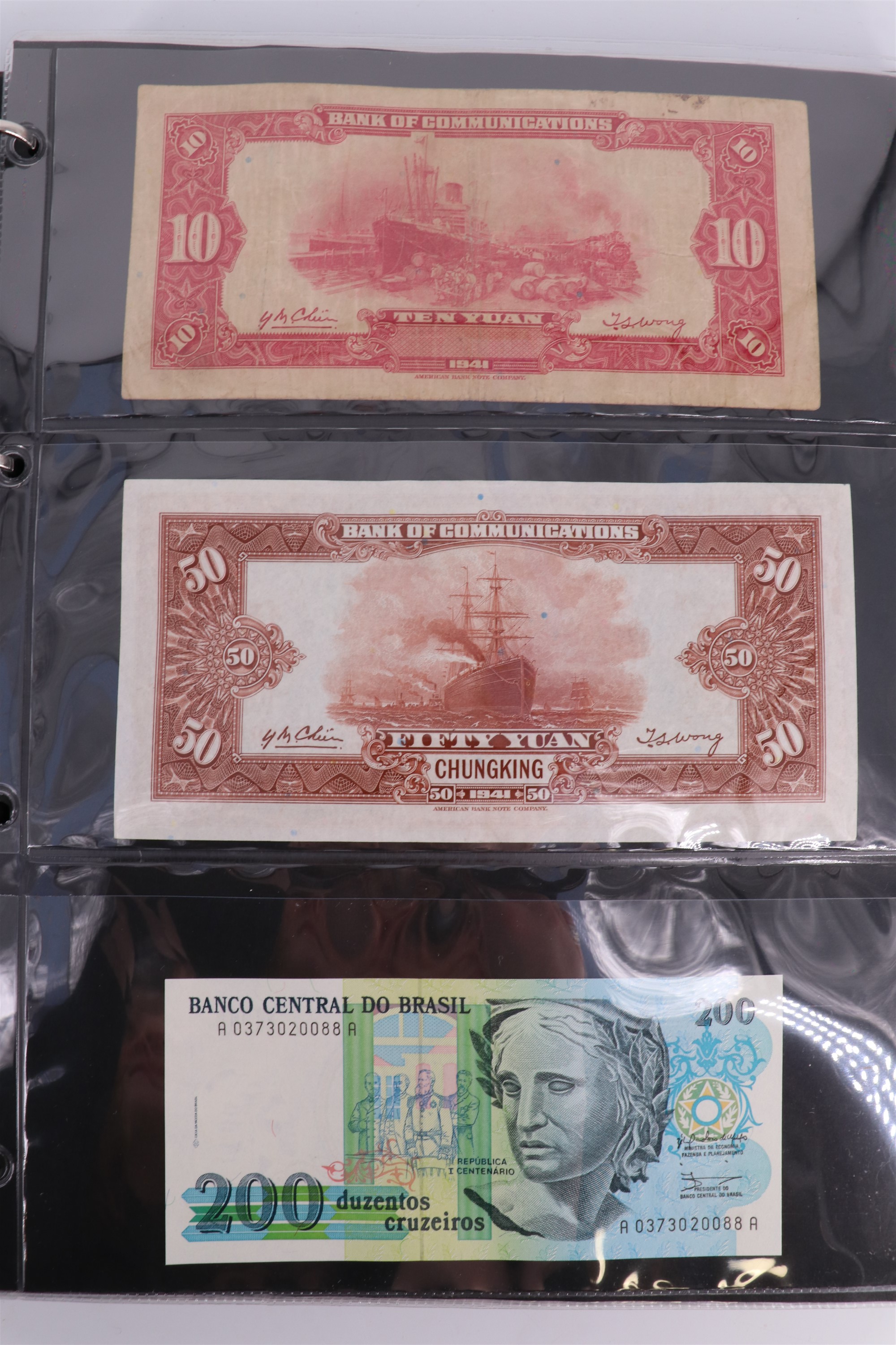 An album containing a collection of world banknotes, including Zaire (DR Congo), Ireland, - Image 24 of 87