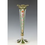An early 20th Century emerald and white Bohemian glass vase, of trumpet form having panels of